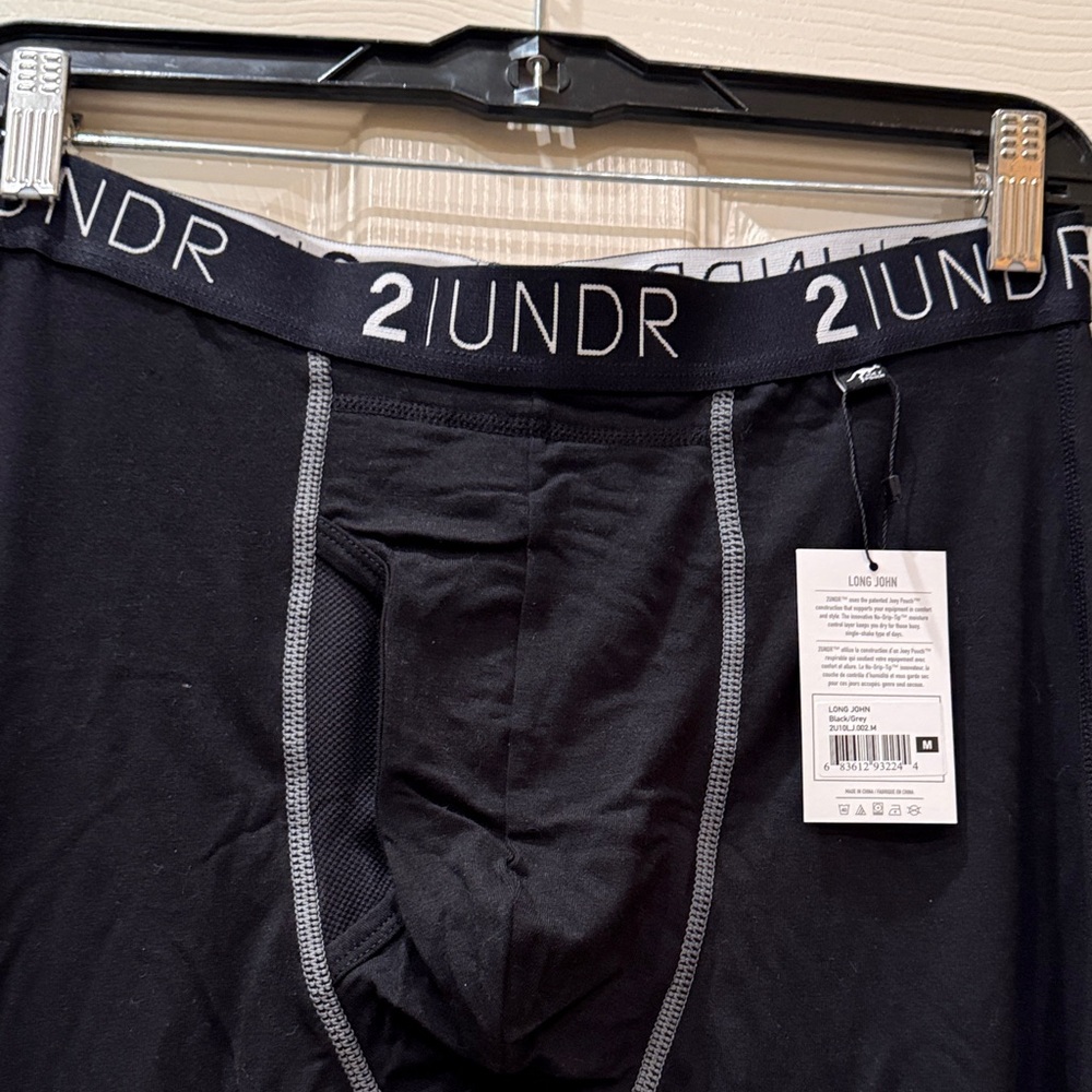 Men's Black 2UNDR compression long underwear.